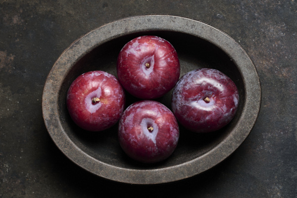 Image of plums in pie dish